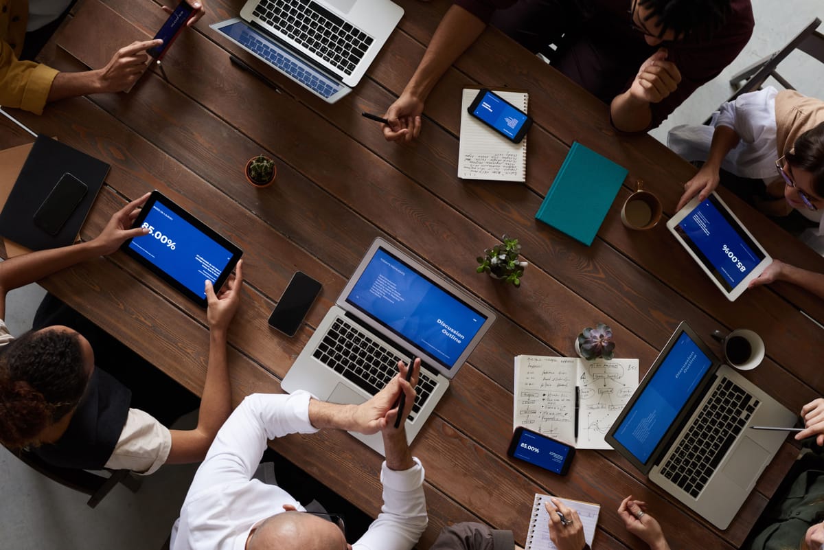 A sales team working together around a table